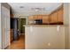 The kitchen showcases wooden cabinetry, granite countertops and stainless steel appliances at 6540 Angel Mountain Ave, Las Vegas, NV 89130
