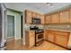 The kitchen has stainless steel appliances, granite countertops, and light wood cabinets at 6540 Angel Mountain Ave, Las Vegas, NV 89130