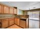 Well-appointed kitchen includes granite countertops, stainless steel appliances and sliding door to the patio at 6540 Angel Mountain Ave, Las Vegas, NV 89130