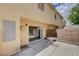 Private outdoor patio area with sliding glass door access to home and a small table at 6540 Angel Mountain Ave, Las Vegas, NV 89130