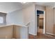 Upstairs hallway with view of closet and neutral colored walls at 6540 Angel Mountain Ave, Las Vegas, NV 89130