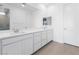 Stylish bathroom with double sinks, quartz countertops, and ample cabinet space at 6557 Corsari Ridge St, Las Vegas, NV 89166