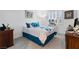 Comfortable bedroom with a queen-sized bed and framed artwork at 6557 Corsari Ridge St, Las Vegas, NV 89166