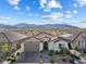 Charming single-story home featuring a desert landscape, paver driveway, and a tile roof at 6557 Corsari Ridge St, Las Vegas, NV 89166