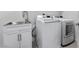 Well lit laundry room with washer, dryer and sink at 6557 Corsari Ridge St, Las Vegas, NV 89166