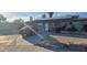 Charming single-story home featuring stone facade, solar panels, and a well-maintained front yard at 6624 Brandywine Way, Las Vegas, NV 89107