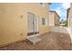 Small backyard featuring a sliding glass door and low-maintenance gravel landscaping at 6743 Windingwood St, Las Vegas, NV 89148