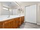 Spacious bathroom featuring a double sink vanity, and a large mirror with vanity lighting at 6743 Windingwood St, Las Vegas, NV 89148