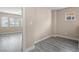 Bright bedroom with laminate flooring, base trim, and several windows providing great natural light at 6743 Windingwood St, Las Vegas, NV 89148