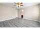 Inviting bedroom featuring laminate flooring, neutral walls, and access to an en-suite bathroom at 6743 Windingwood St, Las Vegas, NV 89148