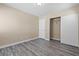 Spacious bedroom featuring gray flooring and a closet with sliding doors at 6743 Windingwood St, Las Vegas, NV 89148