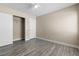 A spacious bedroom featuring gray flooring, a ceiling fan, and a walk-in closet at 6743 Windingwood St, Las Vegas, NV 89148
