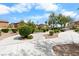 A well-maintained community greenspace with sidewalks, trees, and trimmed bushes at 6743 Windingwood St, Las Vegas, NV 89148