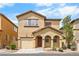 Charming two-story home with a well-maintained front yard and attached garage, perfect for Gathering living at 6743 Windingwood St, Las Vegas, NV 89148