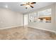 Spacious living area featuring tile flooring and a bright, open layout at 6743 Windingwood St, Las Vegas, NV 89148