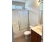 Bathroom with a shower-tub combo, wooden vanity, and tiled floor at 7351 San Pablin St, Las Vegas, NV 89139