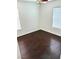 Cozy bedroom with hardwood floors, ceiling fan, and bright windows at 7351 San Pablin St, Las Vegas, NV 89139