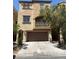Charming two-story home with a balcony, a two-car garage, and inviting curb appeal at 7351 San Pablin St, Las Vegas, NV 89139