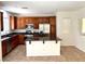 Open kitchen featuring a granite counter, central island, and stainless steel appliances at 7351 San Pablin St, Las Vegas, NV 89139