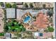 A captivating aerial view of an estate with a pool, putting green, large building and serene landscaping at 7760 Haven St, Las Vegas, NV 89123