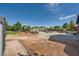 Expansive backyard featuring mature landscaping, a gazebo, and a beautiful rock pool feature at 7760 Haven St, Las Vegas, NV 89123