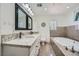 Bathroom featuring granite countertops, a standalone tub, and a toilet at 7760 Haven St, Las Vegas, NV 89123