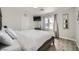 Bedroom featuring a large bed, light wood flooring, and natural light at 7760 Haven St, Las Vegas, NV 89123