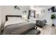 Comfortable bedroom with two beds, light wood flooring, and natural light at 7760 Haven St, Las Vegas, NV 89123