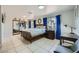 Comfortable bedroom with bright blue curtains, white walls, and a queen-sized bed at 7760 Haven St, Las Vegas, NV 89123