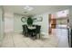 Bright dining area features backyard access and tile flooring adjacent to kitchen at 7760 Haven St, Las Vegas, NV 89123