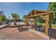 Backyard gazebo with seating area overlooking sparkling pool and lush landscaping at 7760 Haven St, Las Vegas, NV 89123
