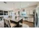 Modern kitchen with granite island, stainless appliances, and bright lighting at 7760 Haven St, Las Vegas, NV 89123