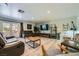 Spacious living room featuring wood floors and plenty of natural light from the backyard access at 7760 Haven St, Las Vegas, NV 89123