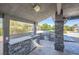 Inviting outdoor kitchen with stone accents, grill, sink, and counter space perfect for entertaining at 7760 Haven St, Las Vegas, NV 89123