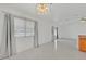 Bright dining area with large windows and neutral decor, adjacent to kitchen at 7925 Placid St, Las Vegas, NV 89123