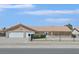 Charming single-story home featuring a three-car garage, desert landscaping, and a secure gated front yard at 7925 Placid St, Las Vegas, NV 89123