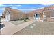Welcoming front entrance with a double door and desert landscaping at 7925 Placid St, Las Vegas, NV 89123
