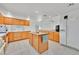 Well-equipped kitchen with island, breakfast bar, bright light, and tile floors at 7925 Placid St, Las Vegas, NV 89123