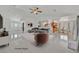 Inviting living space featuring modern decor, open layout, tile floors and kitchen views at 7925 Placid St, Las Vegas, NV 89123