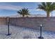 Beautiful backyard patio with pavers, mountain views, and decorative torch lighting feature at 7938 Jessamy St, North Las Vegas, NV 89084