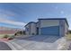 Charming single-story home with xeriscaping, mountain views, a wide driveway, and modern exterior at 7938 Jessamy St, North Las Vegas, NV 89084