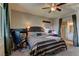 Spacious main bedroom features ceiling fan, workstation, and ensuite bathroom at 7938 Jessamy St, North Las Vegas, NV 89084