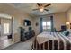 Bedroom offering a large bed, TV, closet, and a private door leading to the backyard at 7938 Jessamy St, North Las Vegas, NV 89084