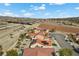A scenic aerial view of houses with pools, palm trees, and neat landscaping in a suburban neighborhood at 7957 Lovely Pine Pl, Las Vegas, NV 89143