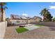 The backyard has stone landscaping, artificial turf, solar panels, and block wall at 7957 Lovely Pine Pl, Las Vegas, NV 89143