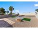 Expansive backyard featuring a spacious patio area and desert landscaping at 7957 Lovely Pine Pl, Las Vegas, NV 89143