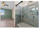 This modern bathroom features a glass shower, stylish tile, and ample space at 7957 Lovely Pine Pl, Las Vegas, NV 89143