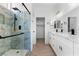 Stylish bathroom with tiled shower, double sinks, and modern fixtures at 7957 Lovely Pine Pl, Las Vegas, NV 89143