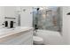 This bathroom features a marble vanity, toilet, and tub with tiled shower at 7957 Lovely Pine Pl, Las Vegas, NV 89143