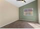 This light bedroom has modern flooring, a ceiling fan, and ample light at 7957 Lovely Pine Pl, Las Vegas, NV 89143